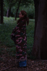 In the pink blanket