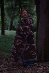 In the pink blanket